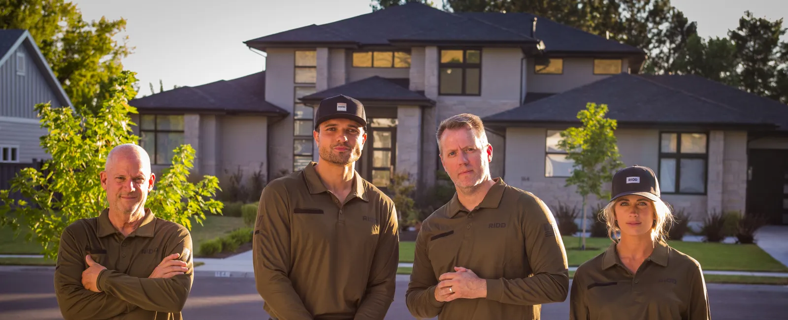 a group of men standing in front of a building