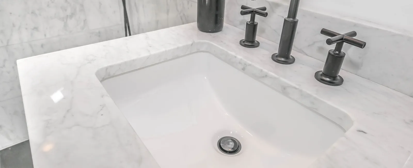 a bathtub with a faucet and a soap dispenser