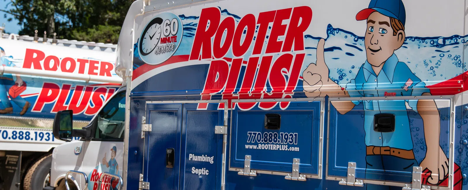 A colorful service truck with 'Rooter Plus!' branding and a cartoon mascot promoting plumbing services.
