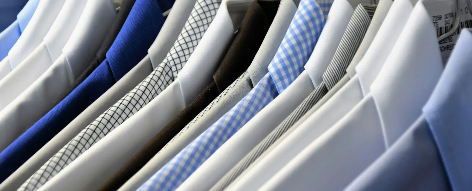 a close-up of a row of blue shirts