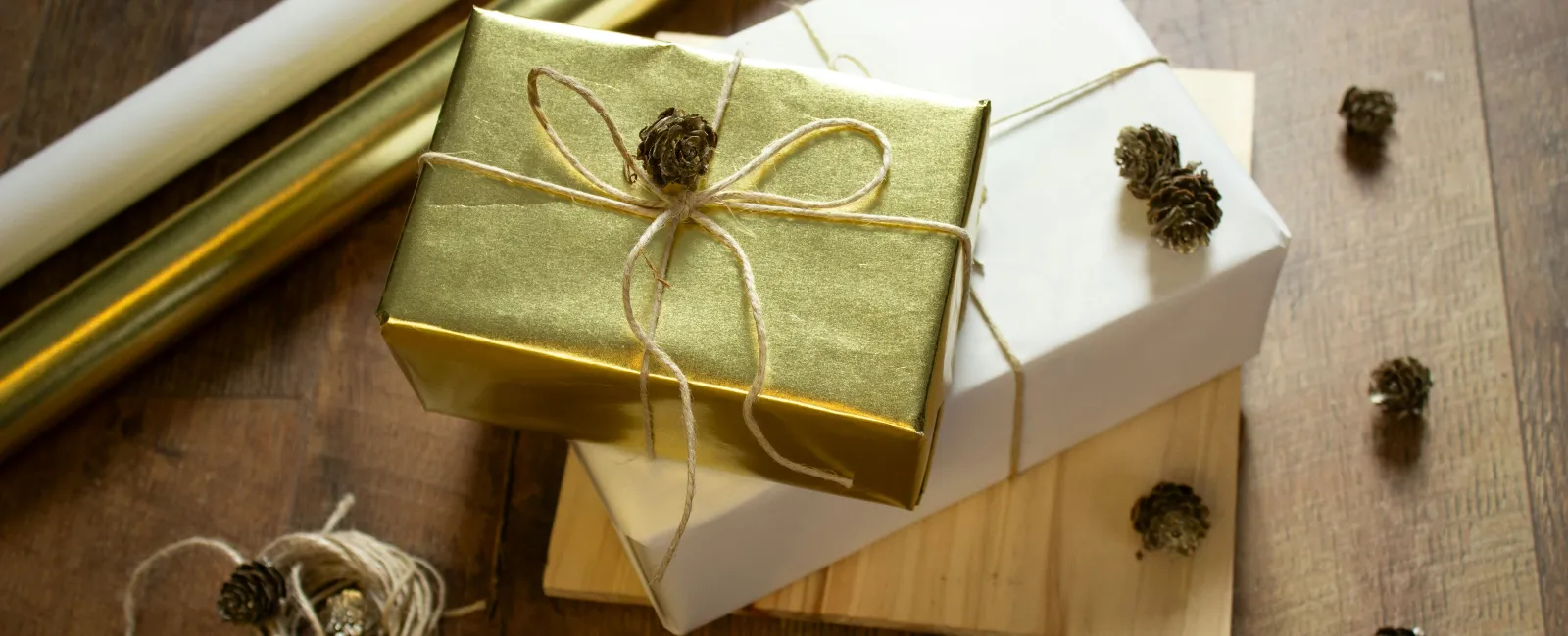 a white box with a gold ribbon