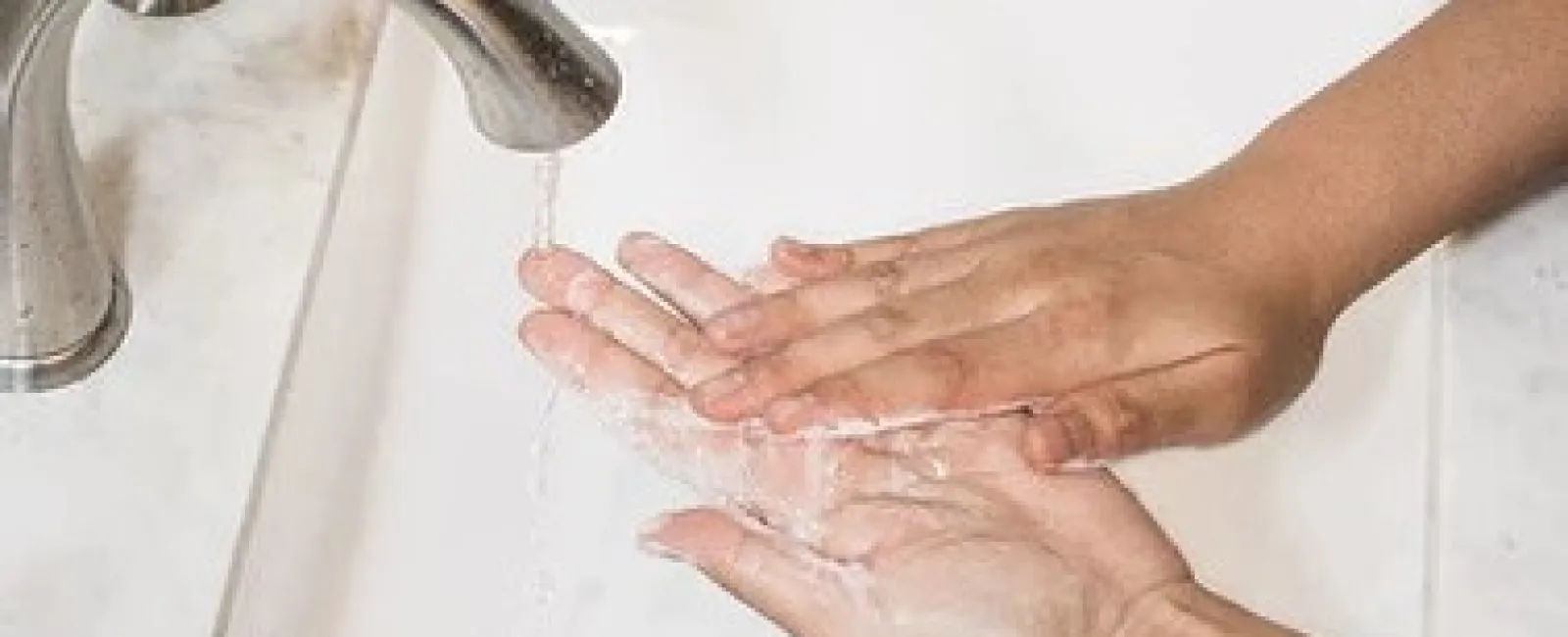 a person washing their hands