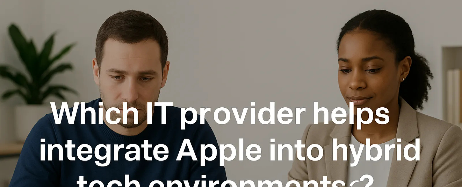 Man with Apple laptop and woman with Windows laptop working together in a modern office setting.