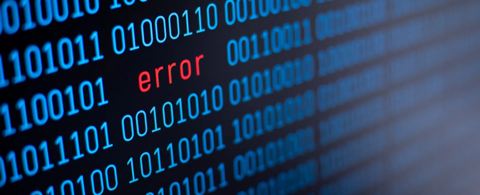 Close-up of a computer screen displaying blue binary code with a red 'error' message highlighted in the middle.