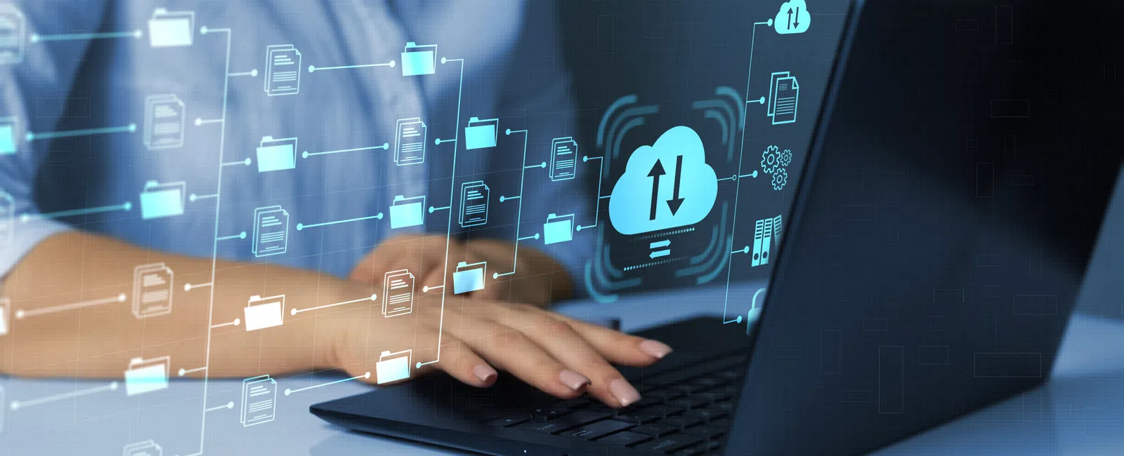 Person typing on laptop with digital cloud storage and file sharing icons overlayed representing data transfer.