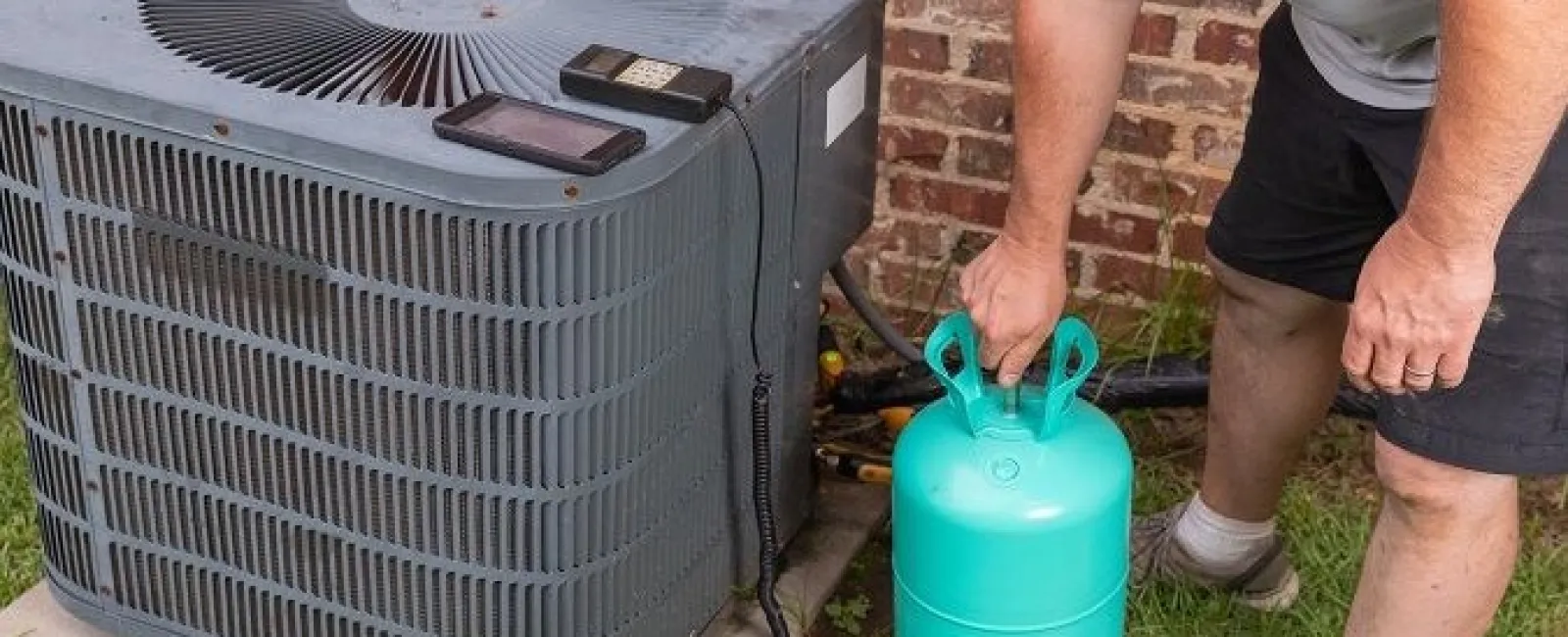 a man putting a gas stove in a yard