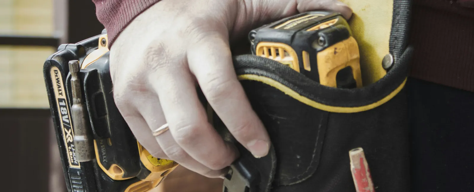 a person holding a pair of shoes