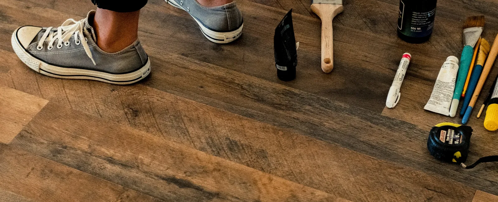 a person standing on a wood floor