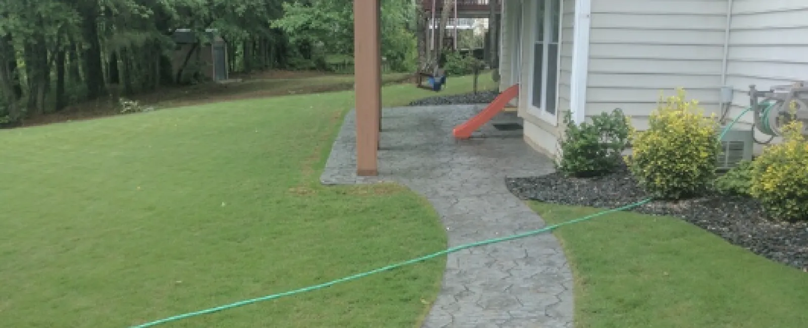 a small play structure in a yard