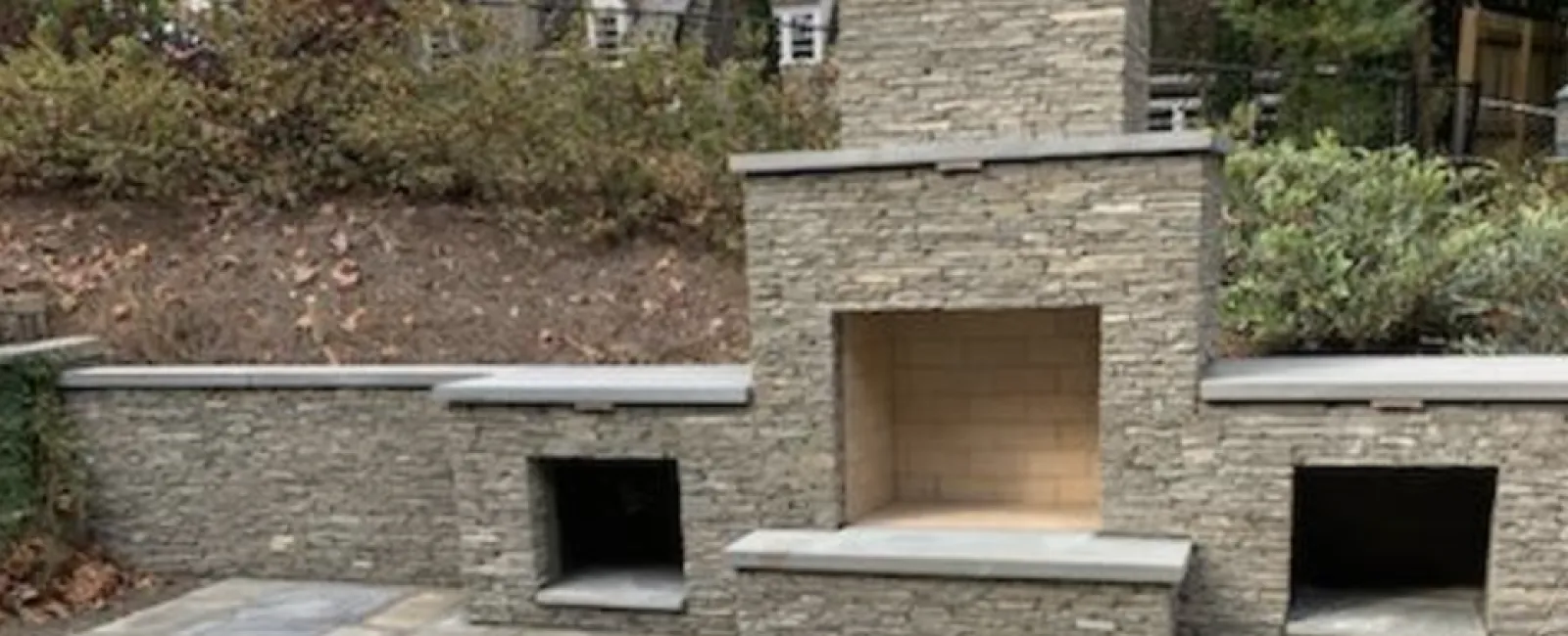 a stone building with a stone patio