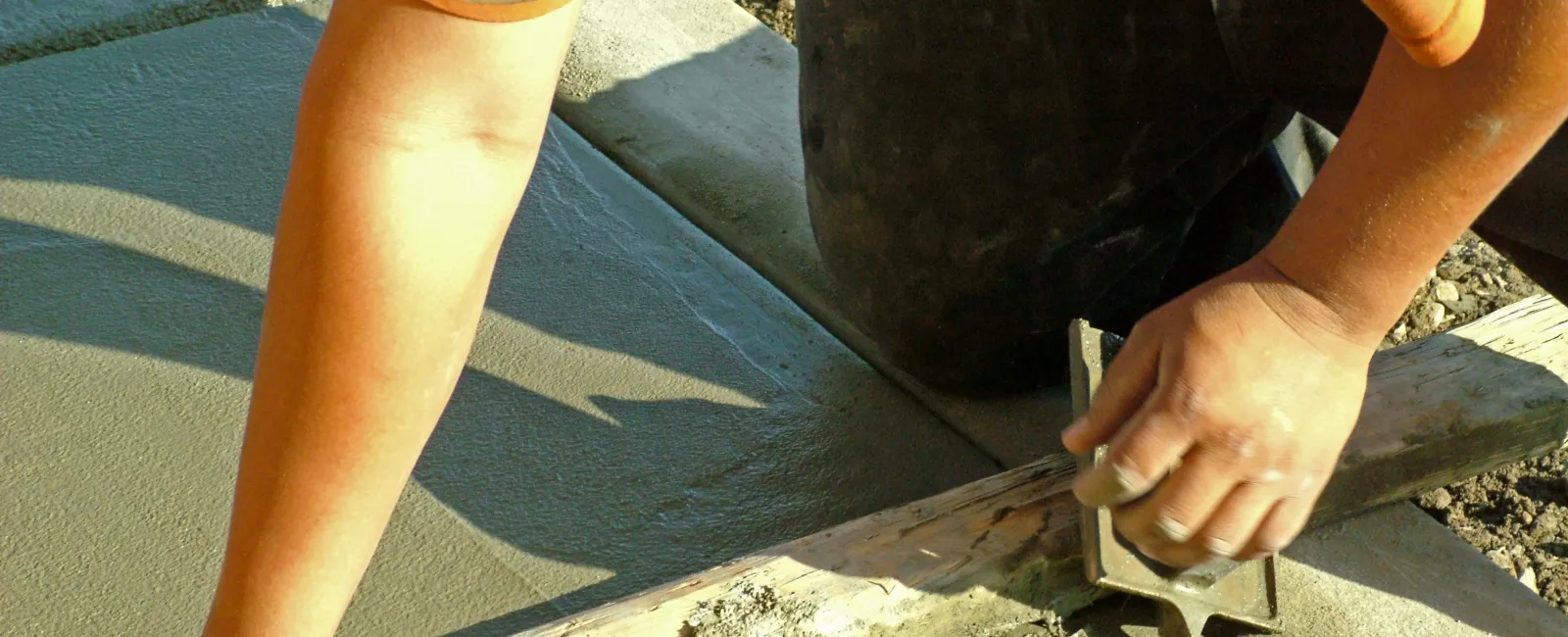 a person using a tool to cut a piece of wood