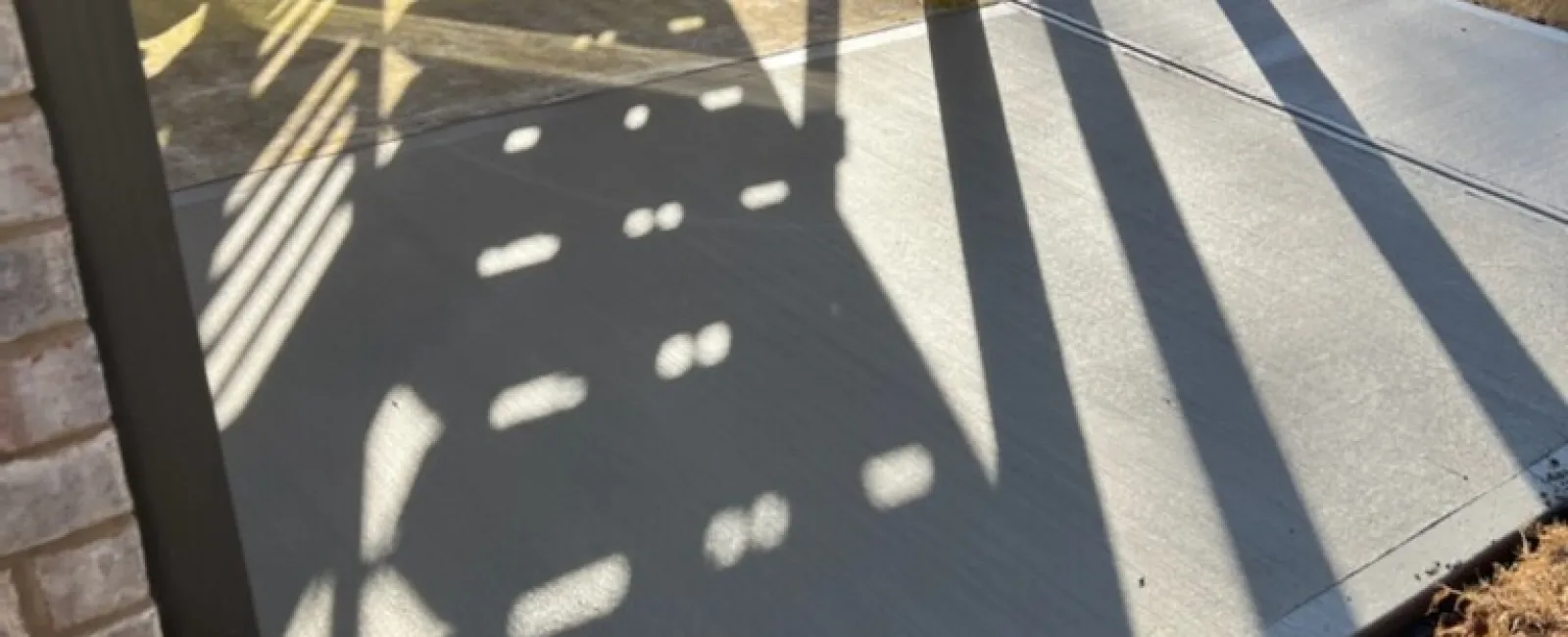 a shadow of a person on a deck