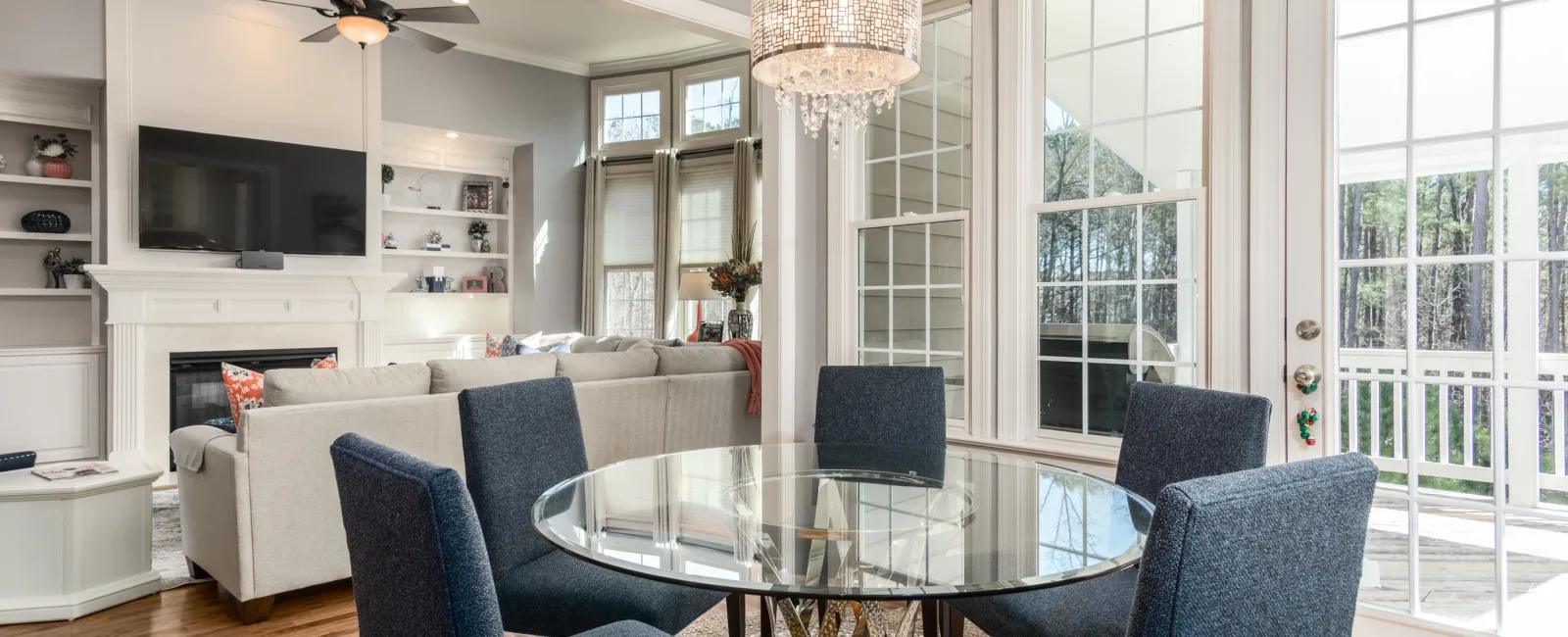 a living room with a table and chairs