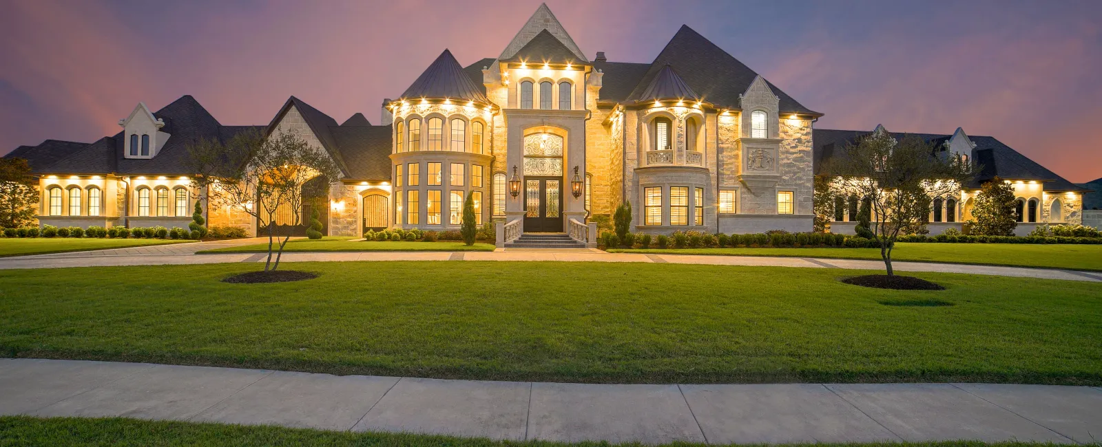 a large house with a lawn in front of it