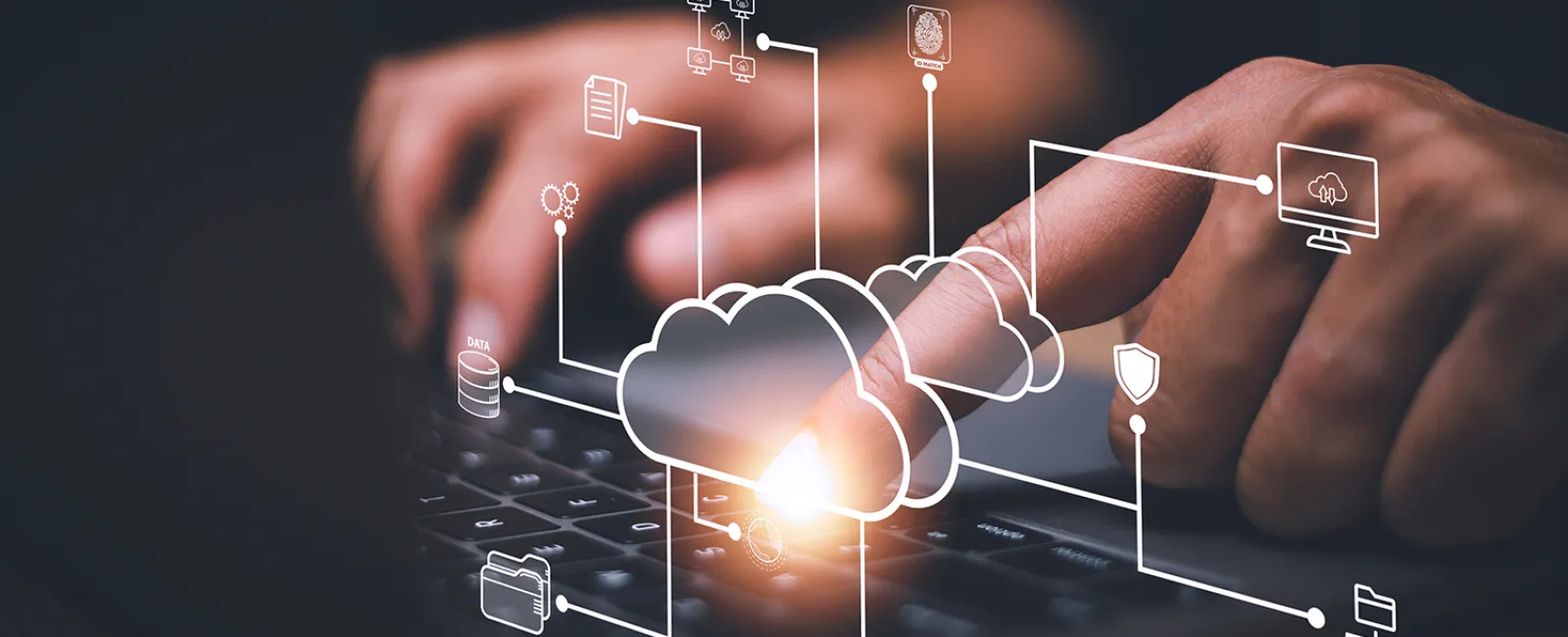 A person typing on a keyboard with cloud solutions superimposed over the image.