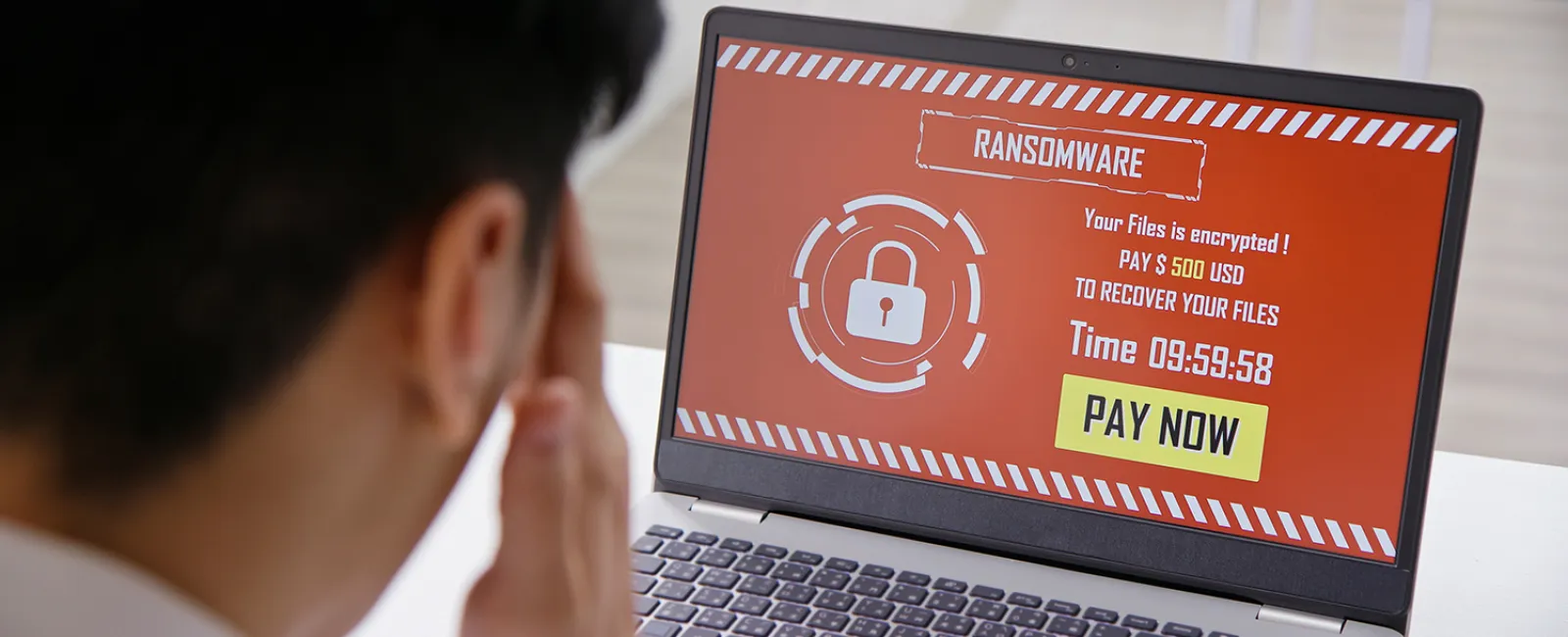 a businessman attacked by a ransomware