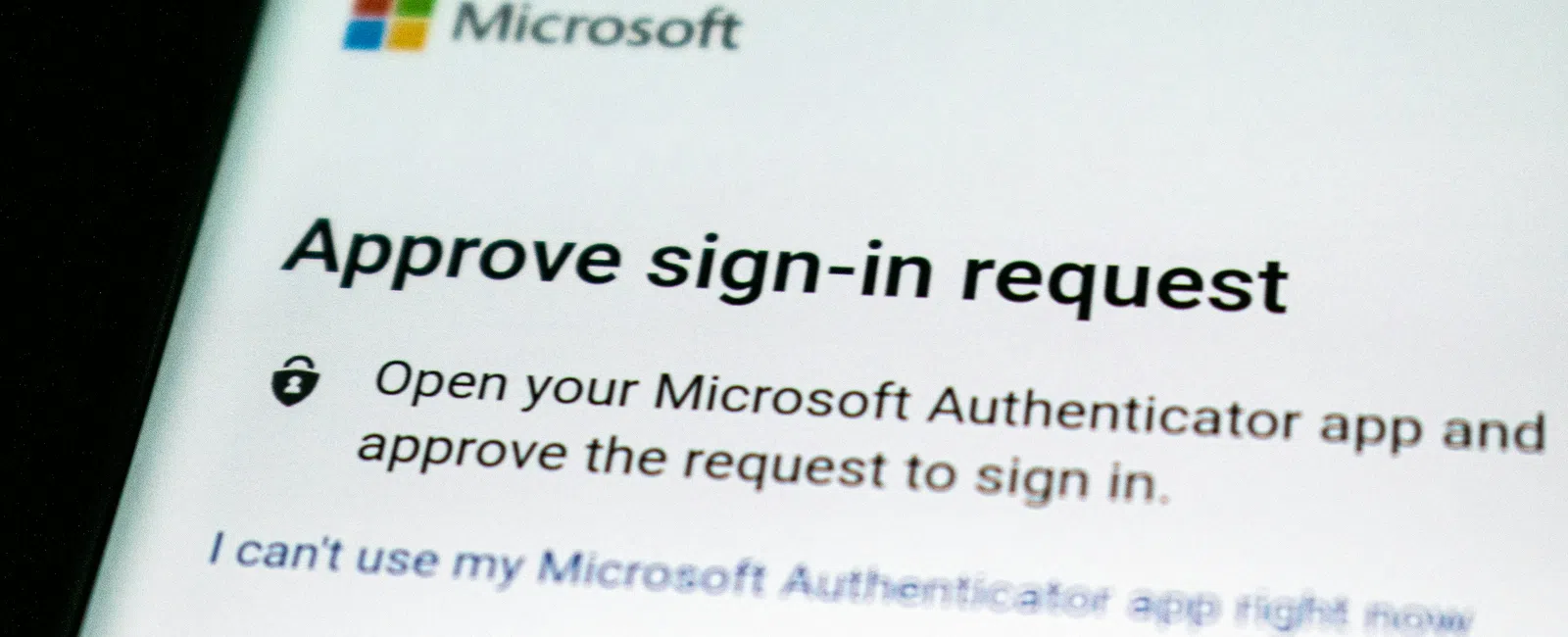 Microsoft sign-in approval screen asking to approve sign-in request using Microsoft Authenticator app on smartphone.