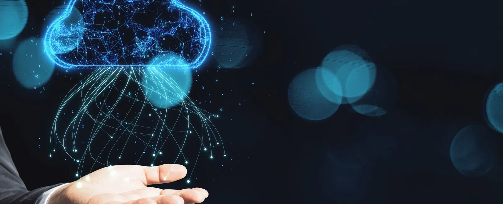 Hand holding a glowing digital cloud network symbolizing data storage and cloud computing technology.