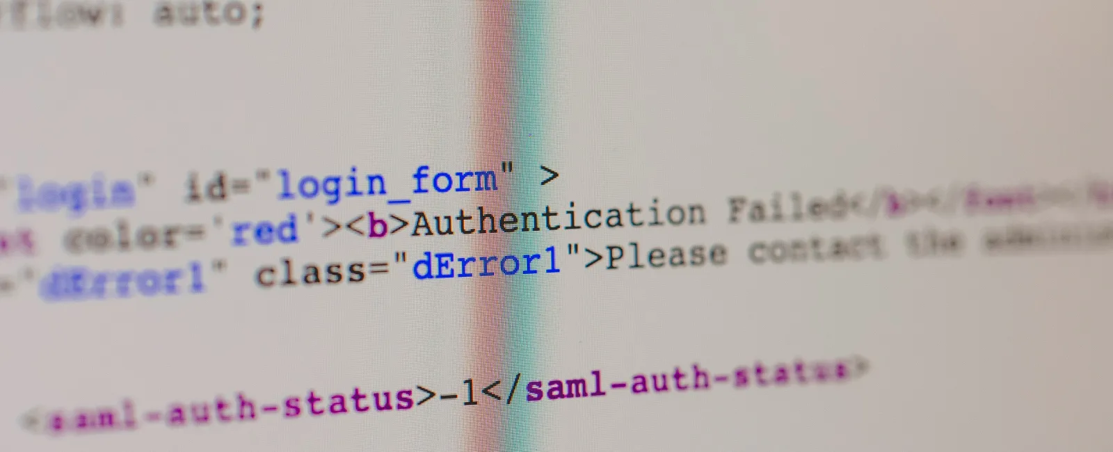 Close-up of computer screen showing HTML code with multi-factor authentication fail error message
