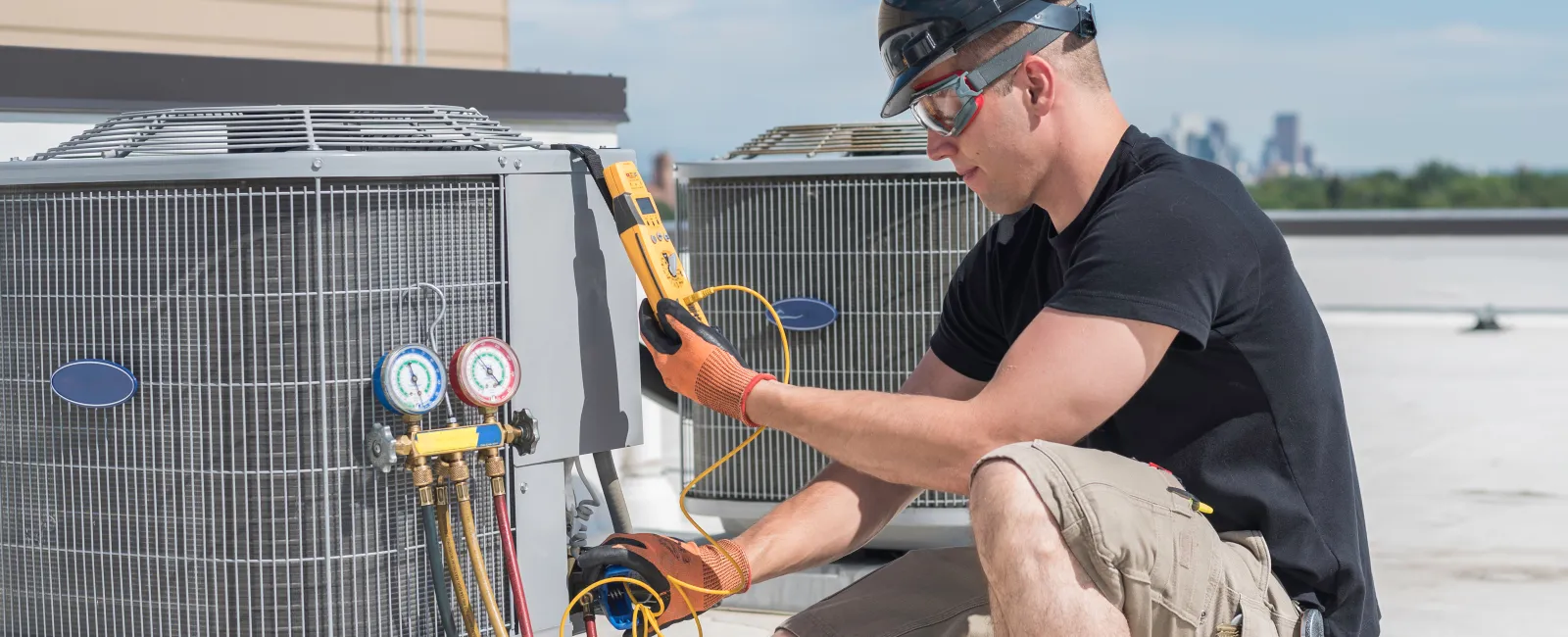 The Air Company of GA technician inspecting a noisy gas furnace in an Atlanta home