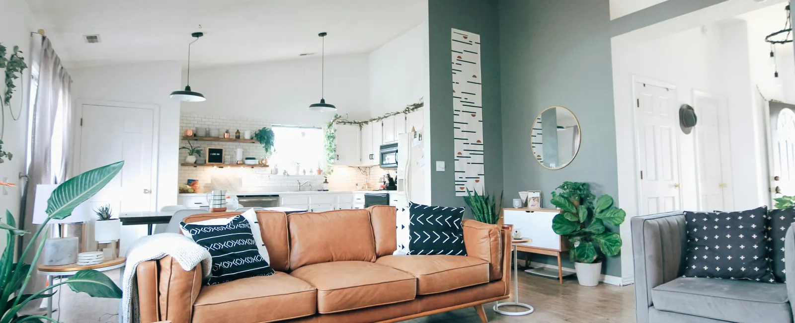 a living room with a couch and chairs