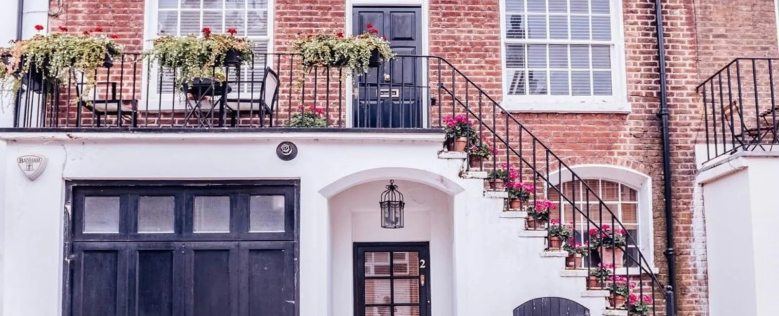 a brick building with a black door and windows