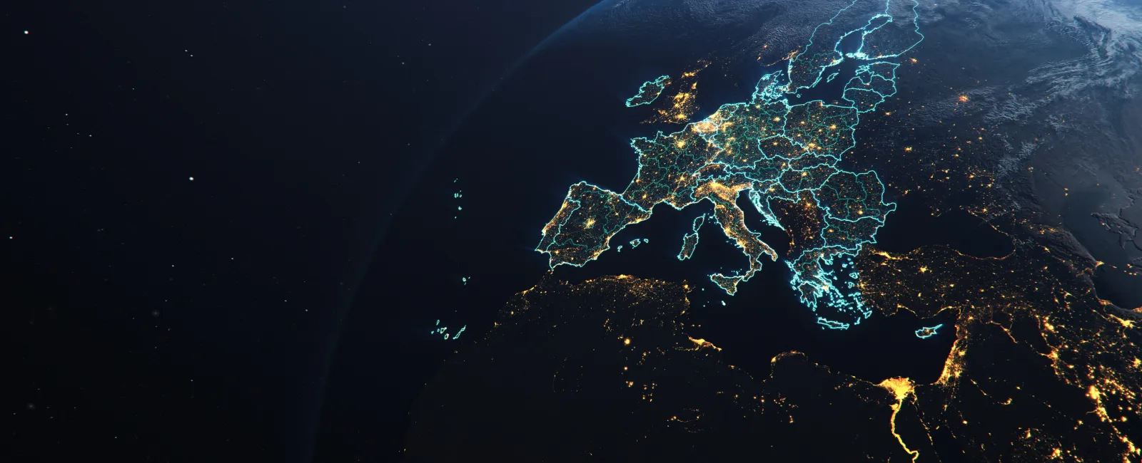 Satellite view of Europe at night showing illuminated cities and country borders with a glowing blue outline.