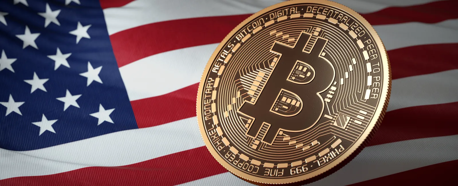 Close-up of gold Bitcoin coin on a folded American flag symbolizing cryptocurrency and USA economy.