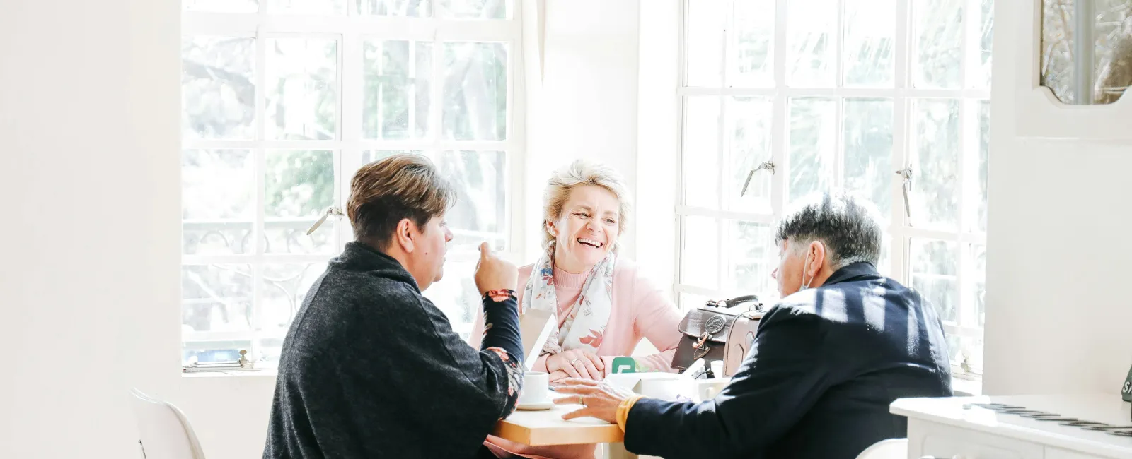 a group of people sitting around a table