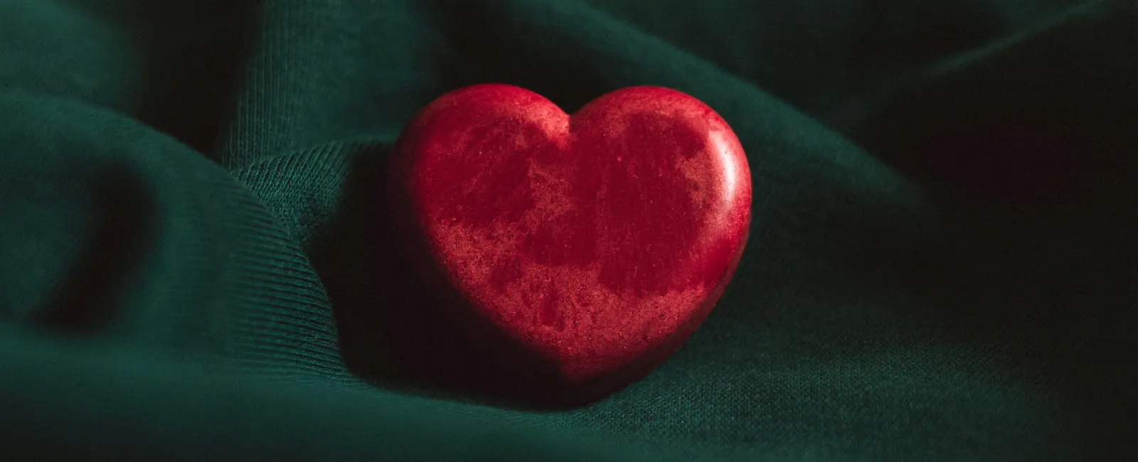 a red heart that demonstrates care