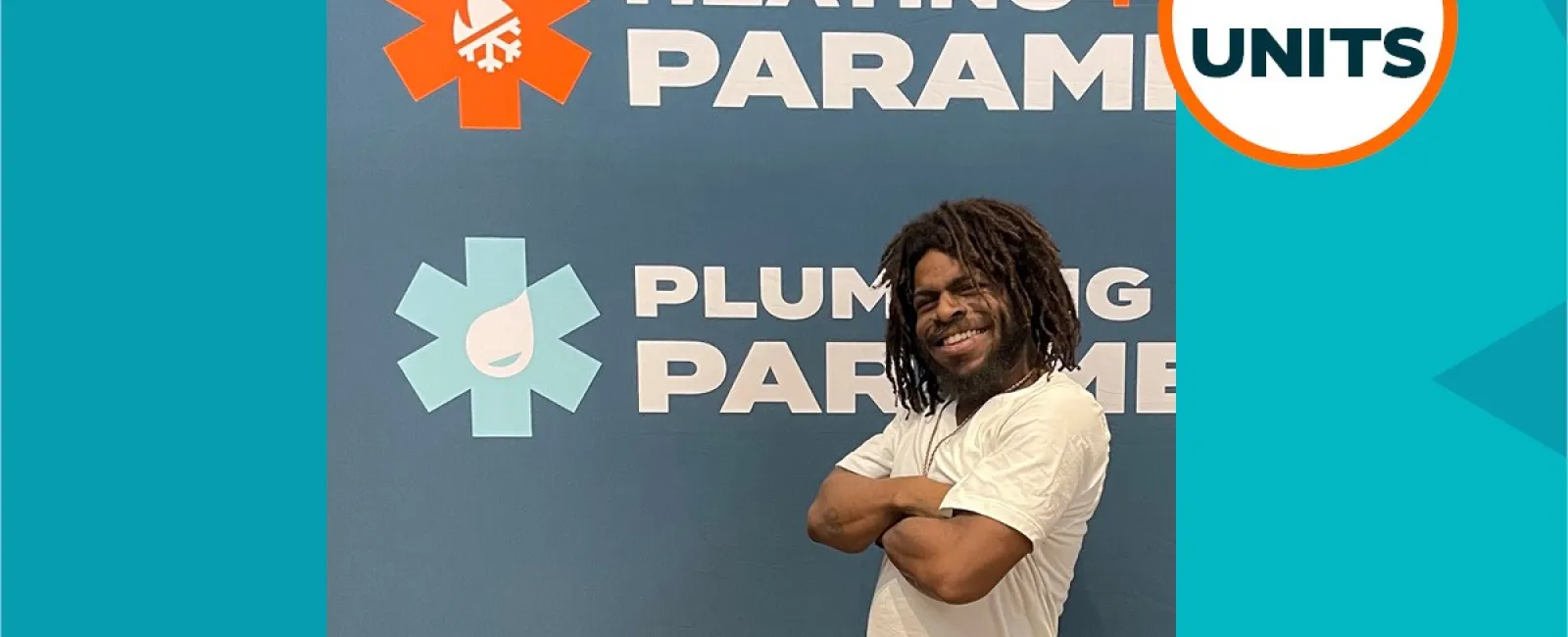 Korey Middleton in front of Plumbing + Heating Paramedics sign, announcing new franchise owner with 2 units in Macon, GA