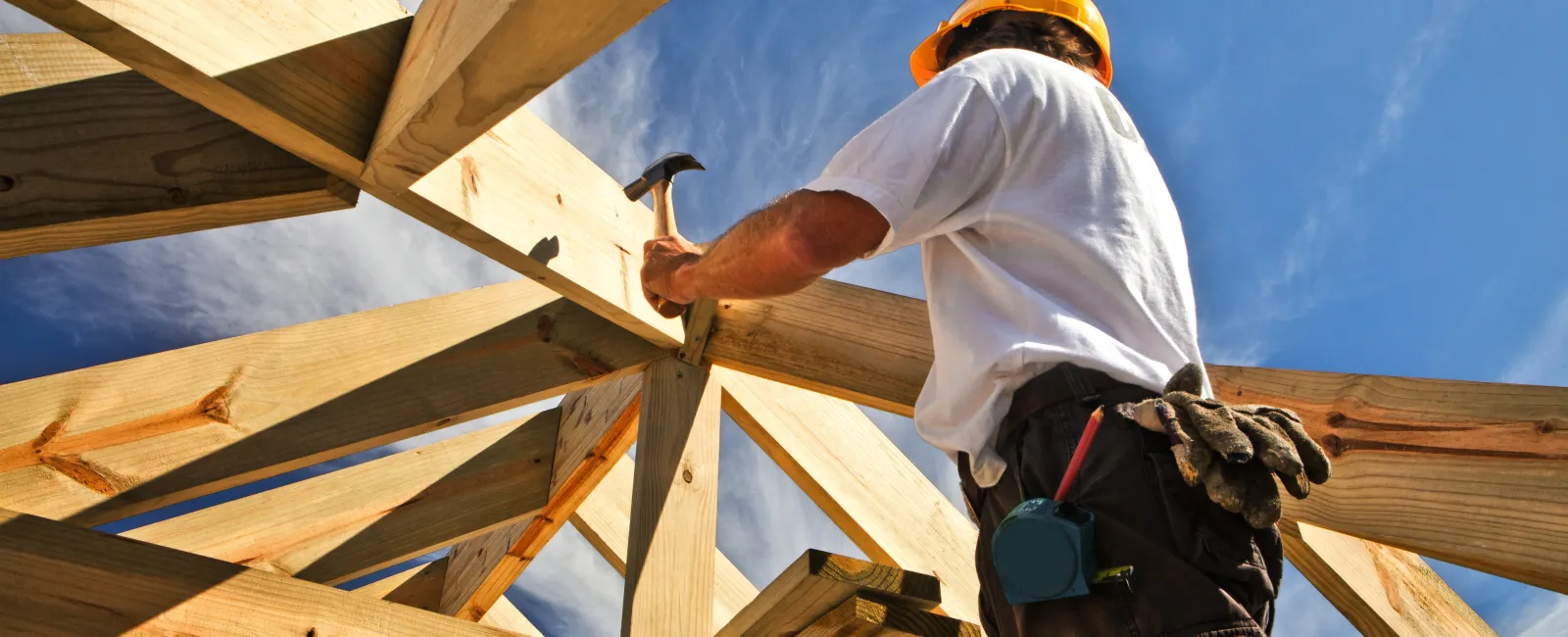 a man building a roof