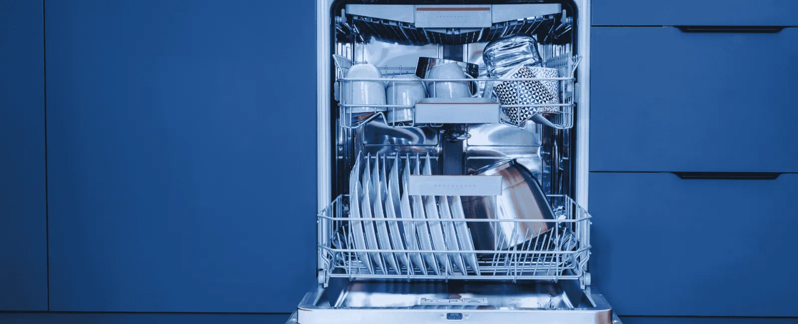 Open dishwasher filled with clean dishes, cups, and utensils inside a modern blue kitchen cabinet.