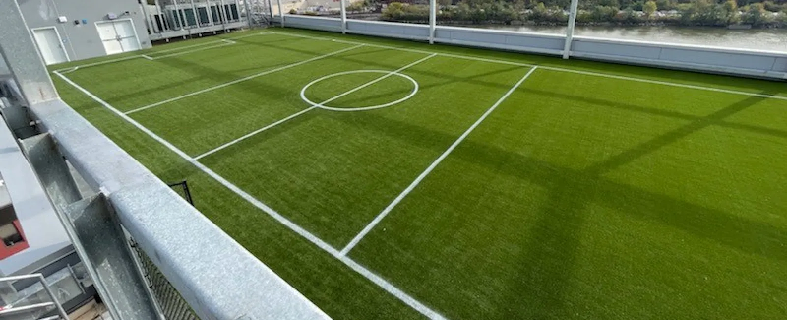 a sports field with a fence