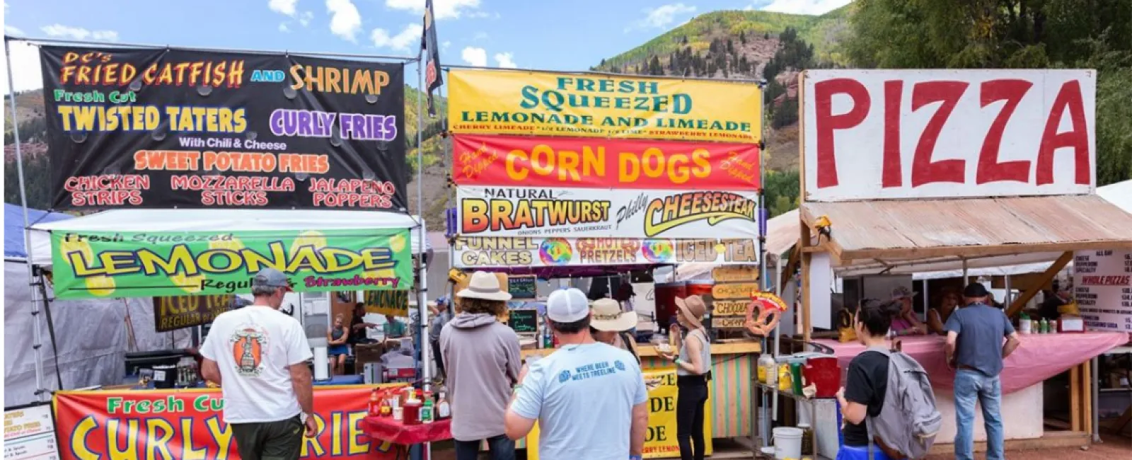 people standing in front of a sign