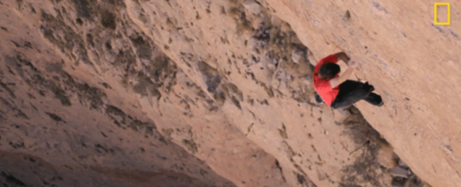 a person climbing a rock