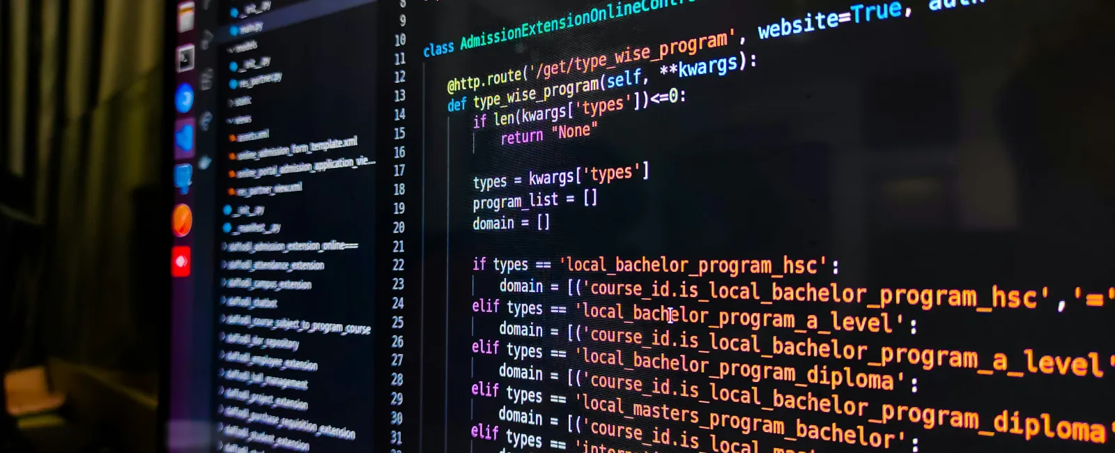 Computer screen displaying Python code for a web controller managing admission programs and course types.