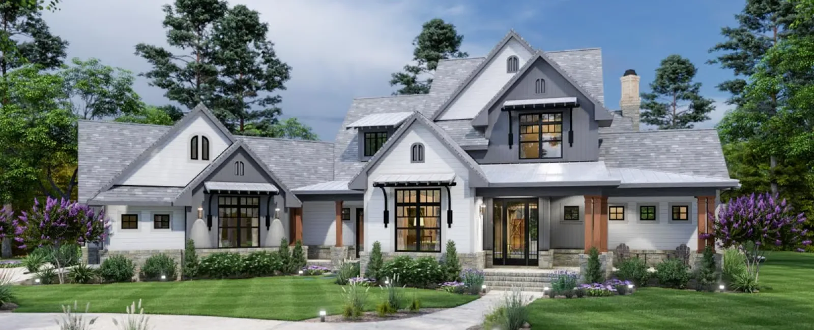 Modern farmhouse exterior with landscaped garden, stone pathway, and vibrant greenery under a clear blue sky.