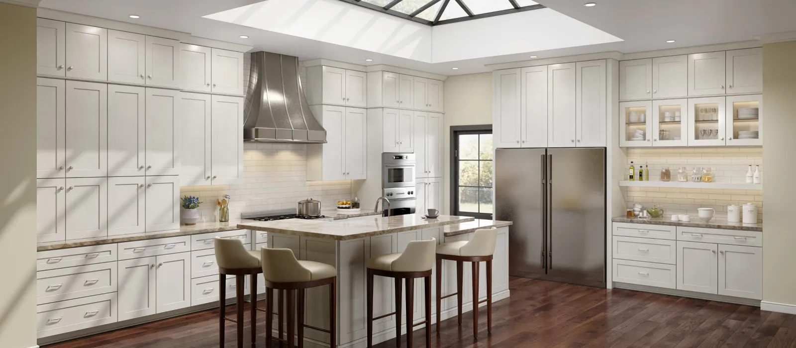Spacious modern kitchen with white cabinets, large island seating four, stainless steel appliances, and skylight ceiling.