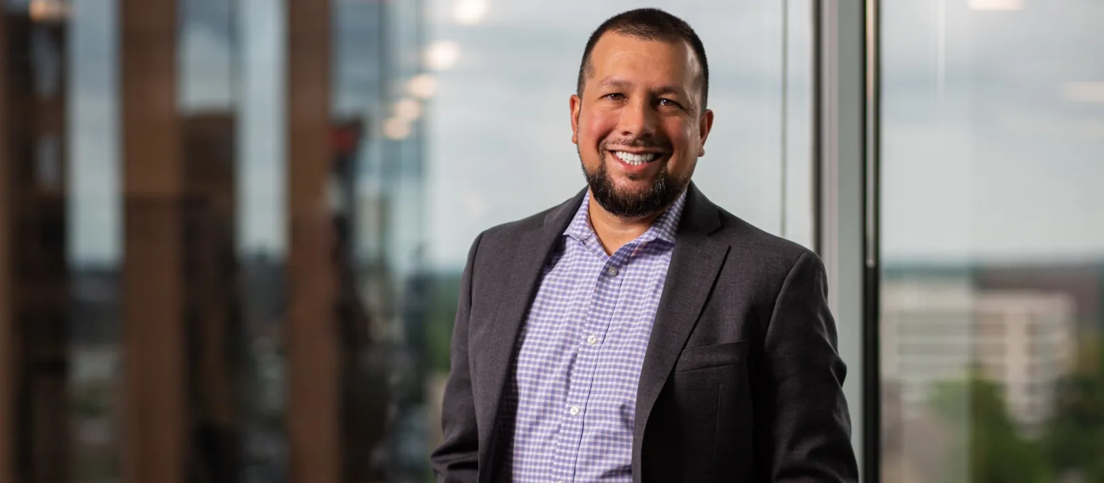 a man in a suit smiling