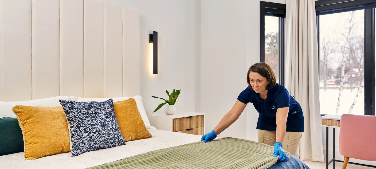MaidPro Arvada maid service making a bed for someone in Thornton, Colorado