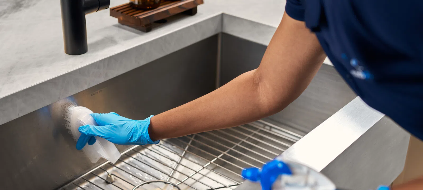 MaidPro Miami Beach maid services cleaning a kitchen sink
