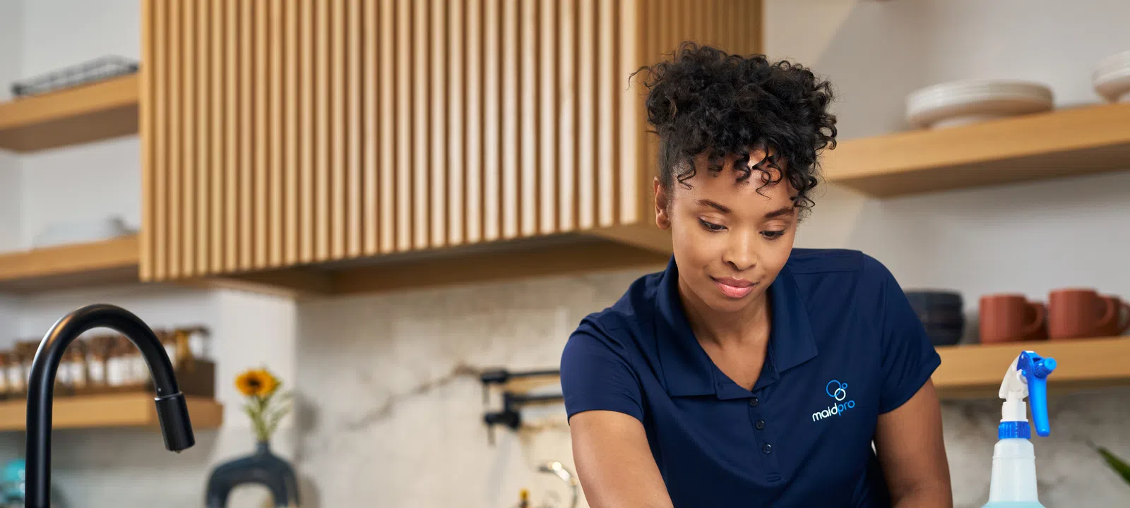 MaidPro Hudson maid service and house cleaning professional cleaning a kitchen counter