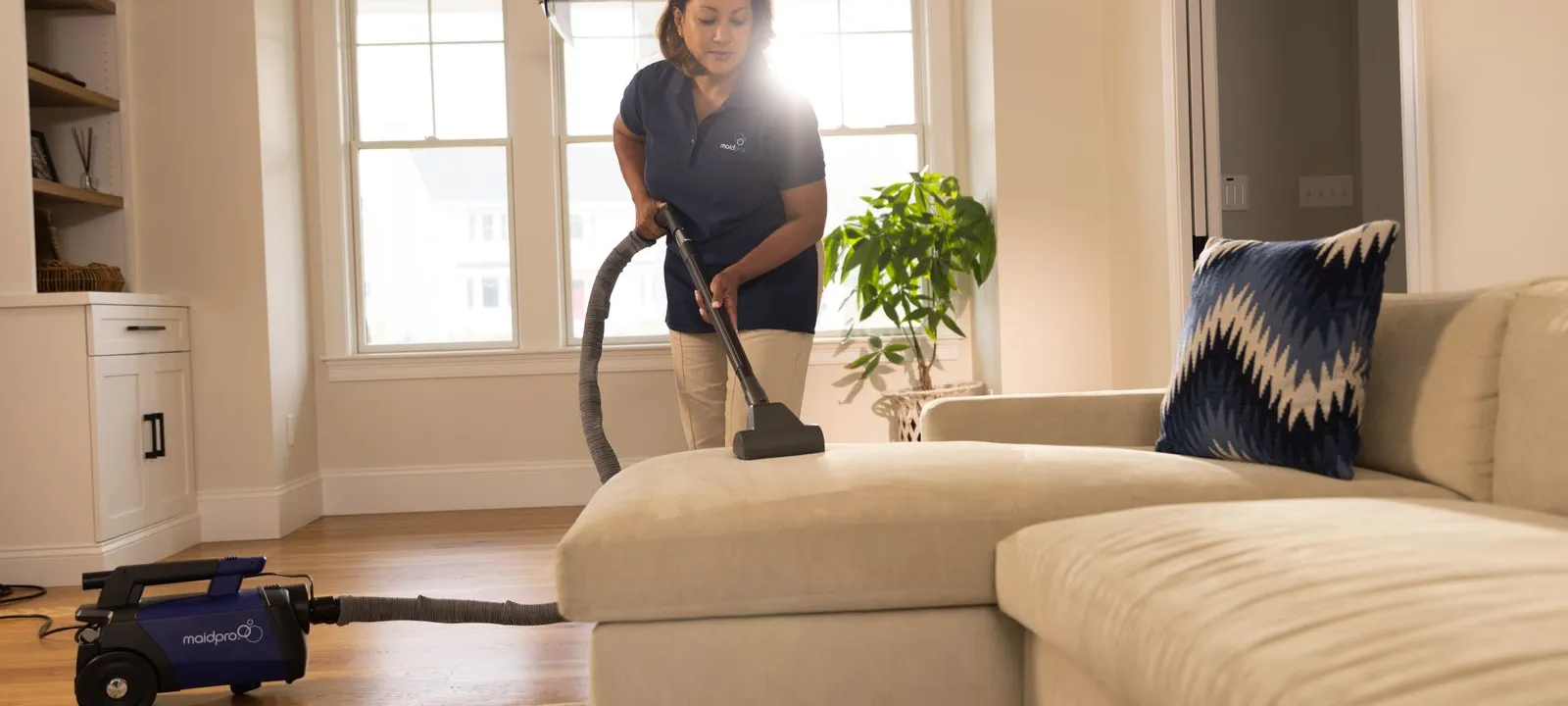 a person vacuuming a living room
