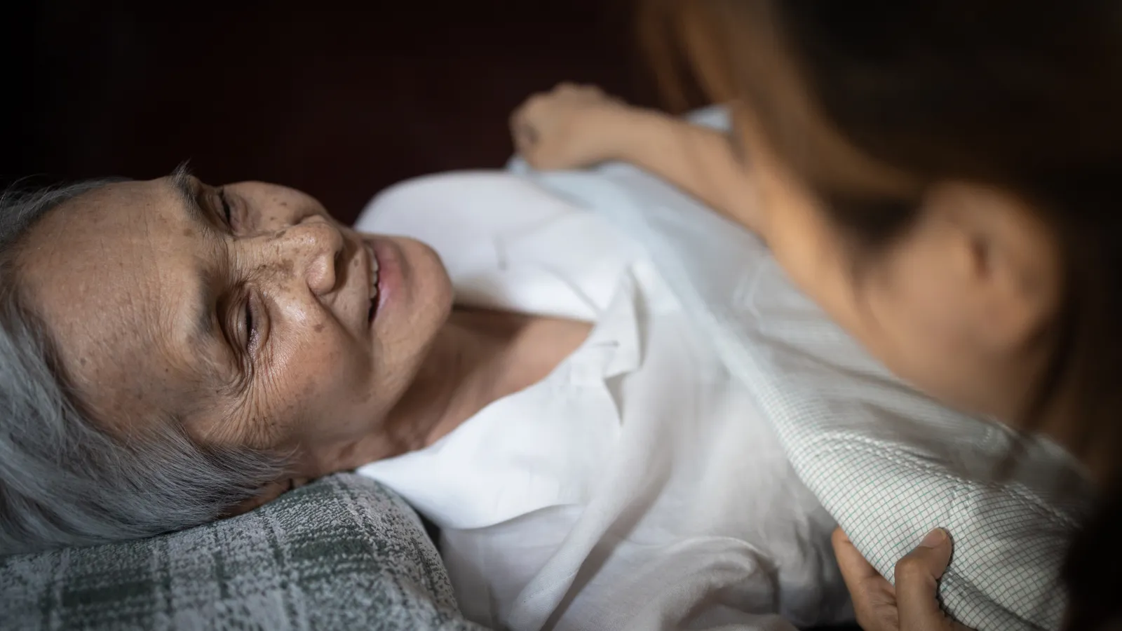 a person lying down with a baby