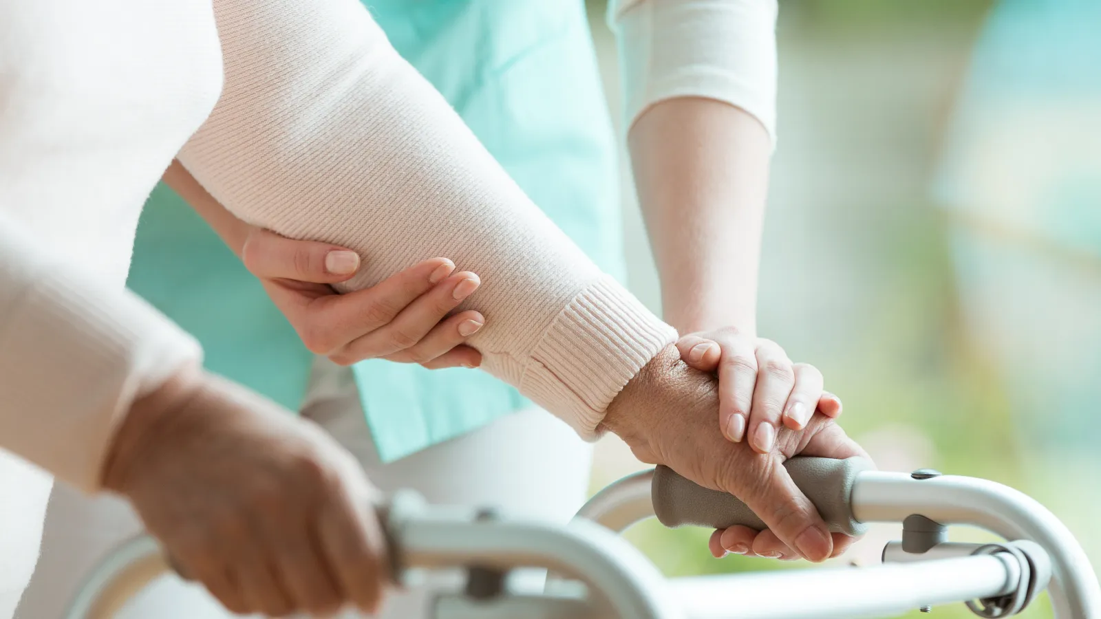 a close-up of people pushing a walker