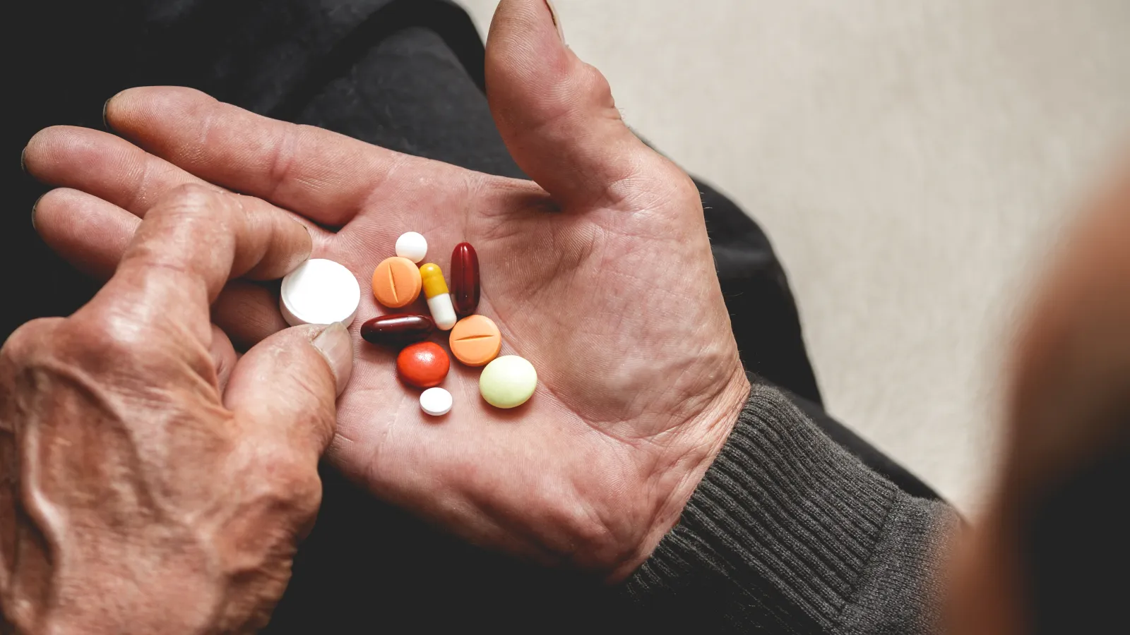 a person holding pills