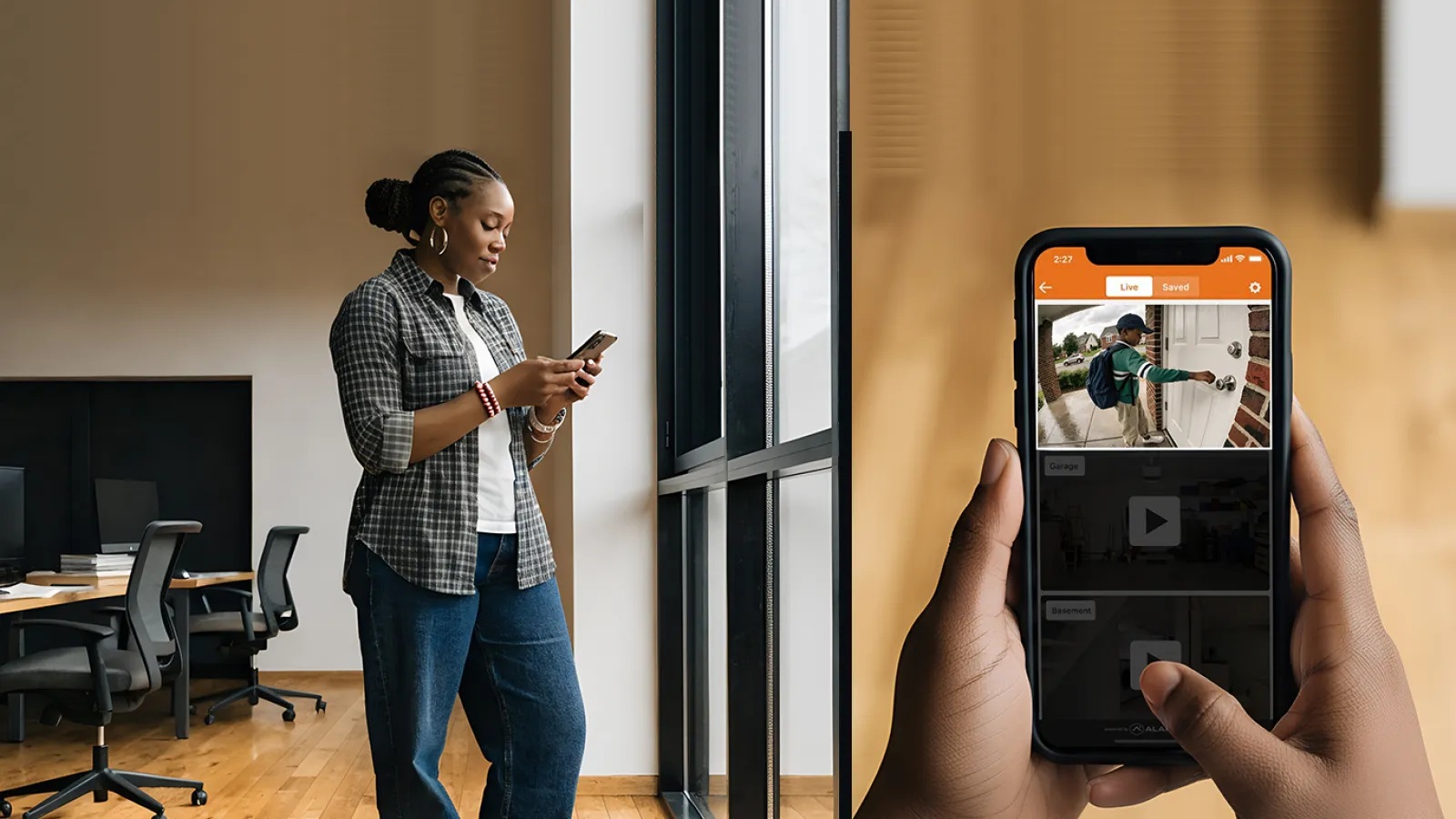Woman standing by a window in an office looking at her smartphone with a home security app showing a visitor on screen.