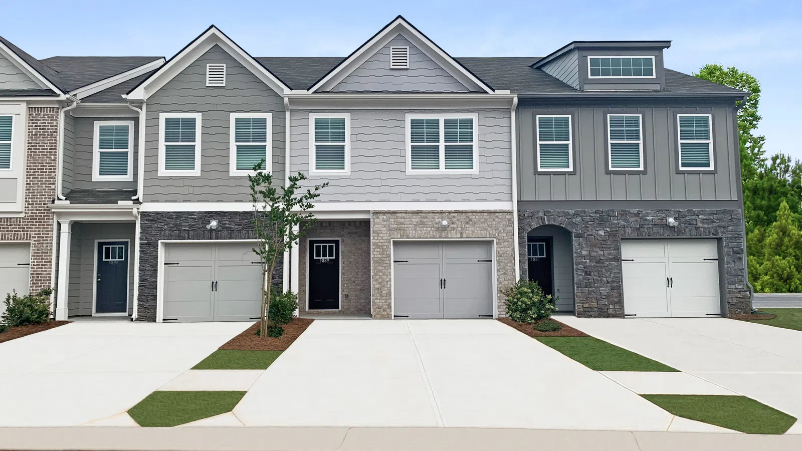 Row of modern townhouse units with attached garages in Lithonia