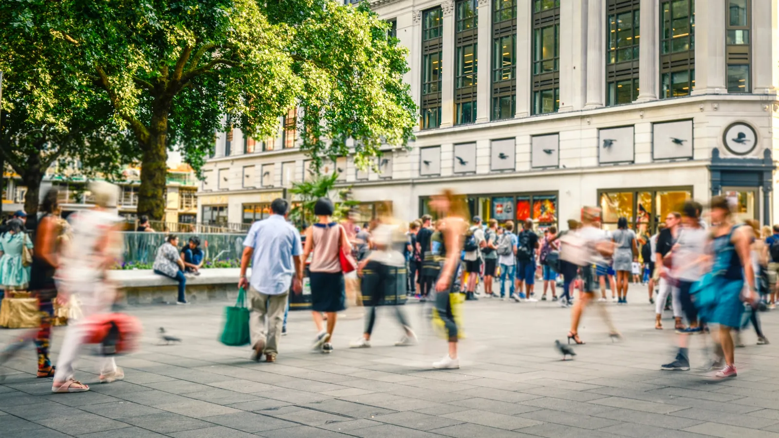 a group of people walking on a street